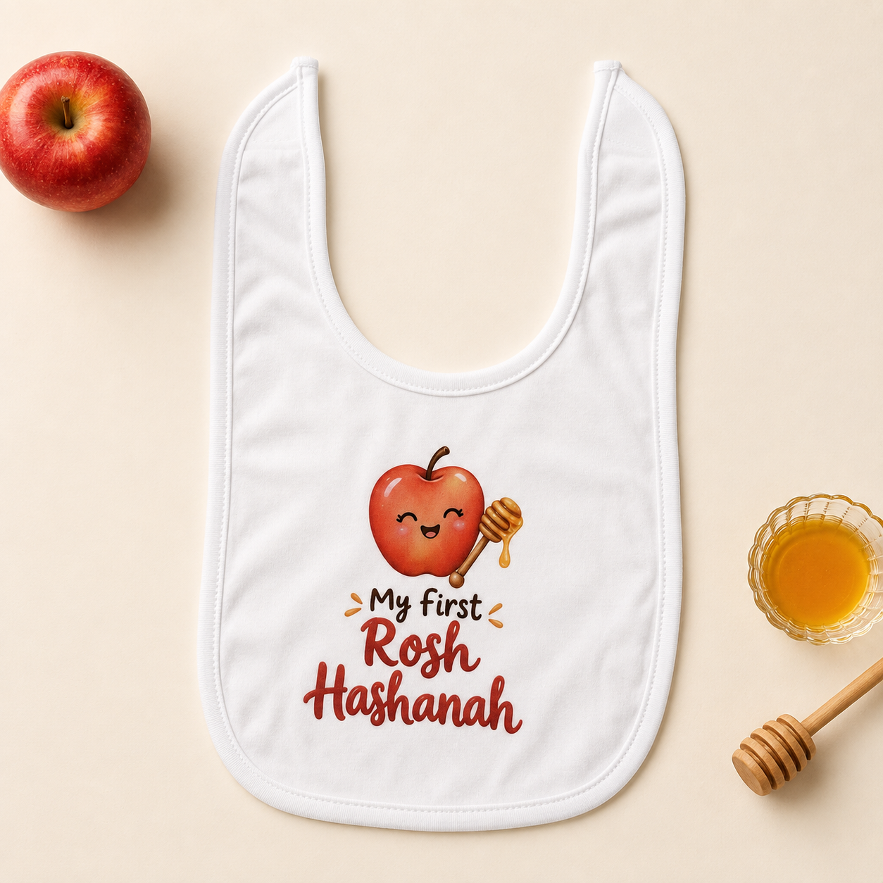 Baby's First Rosh Hashanah white bib with smiling apple and honey dipper design