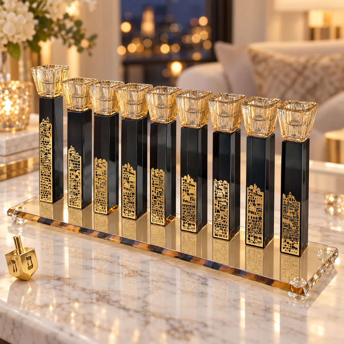 Black crystal Hanukkah menorah with gold cityscape details displayed on a marble console in a warmly lit home