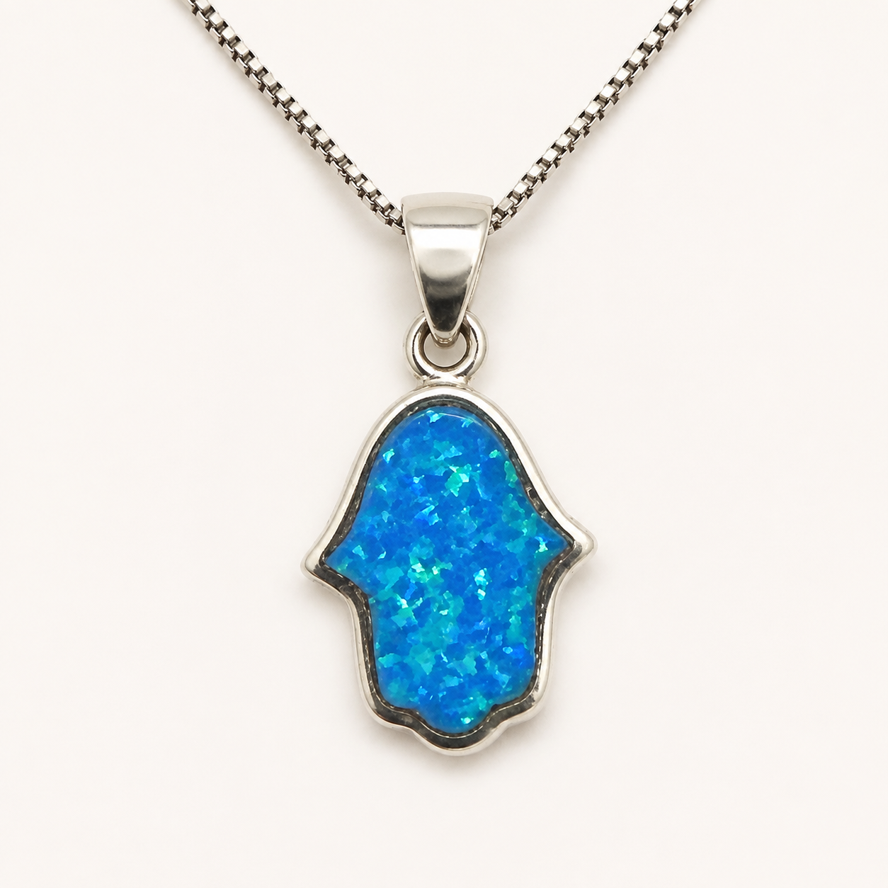 Women's rounded blue opal Hamsa sterling silver necklace