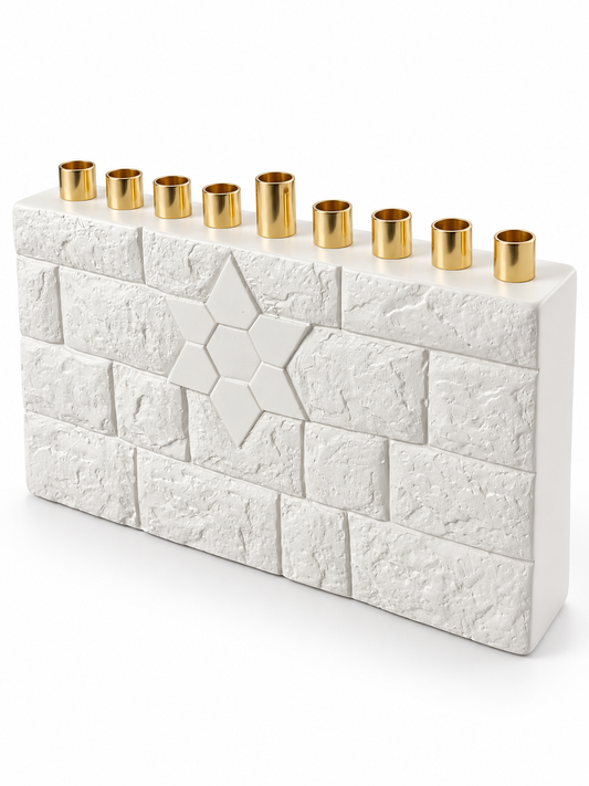 Angled view of the white concrete Star of David menorah showing the brick-pattern front, smooth side, and nine gold-tone candle holders.