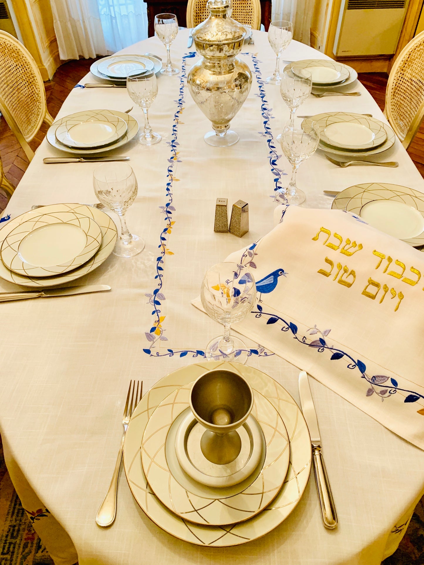 The Blue Bird Tablecloth Embroidered on Pure White Linen. Matching Challah Cover is available