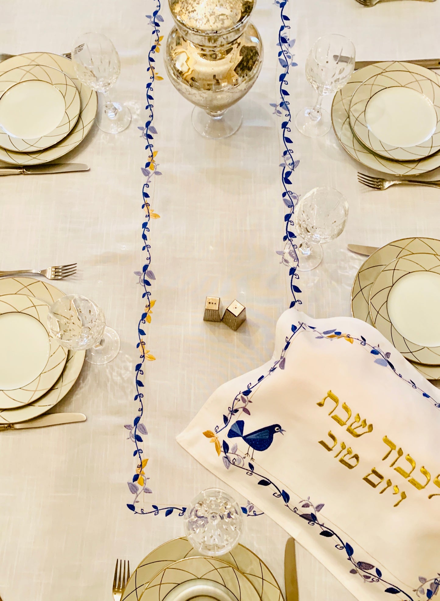 The Blue Bird Tablecloth Embroidered on Pure White Linen. Matching Challah Cover is available