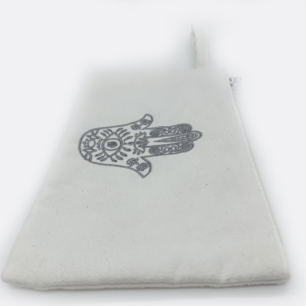 Embroidered hamsa Suede black or white bag zipper closure. Satin lining.