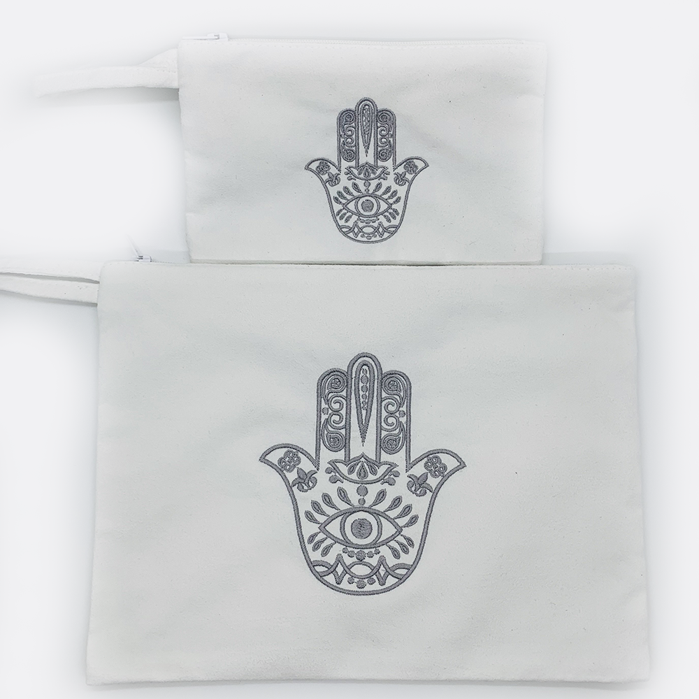 Embroidered hamsa Suede black or white bag zipper closure. Satin lining.