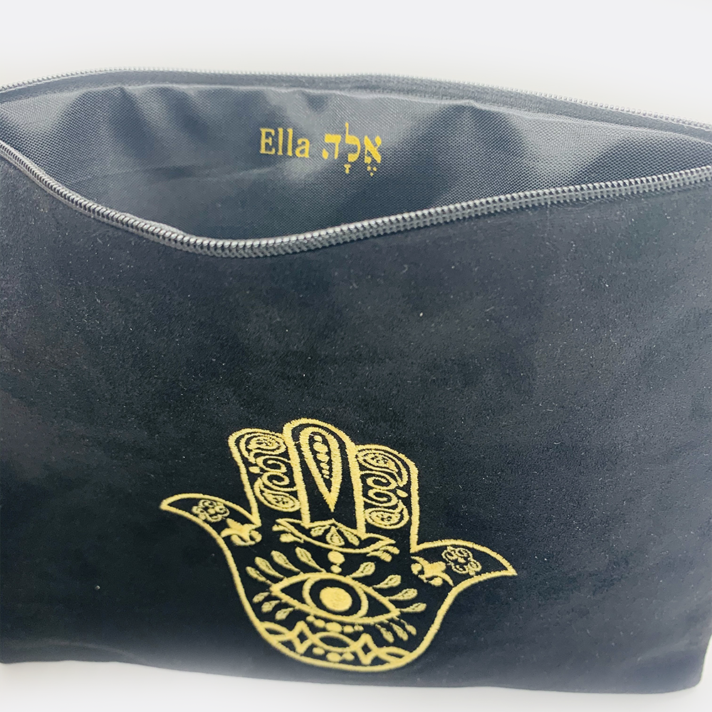Embroidered hamsa Suede black or white bag zipper closure. Satin lining.