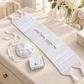All-white baby Brit Milah set arranged in an elegant nursery