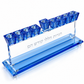 Angled overhead view of blue crystal Hanukkah menorah with raised center shamash