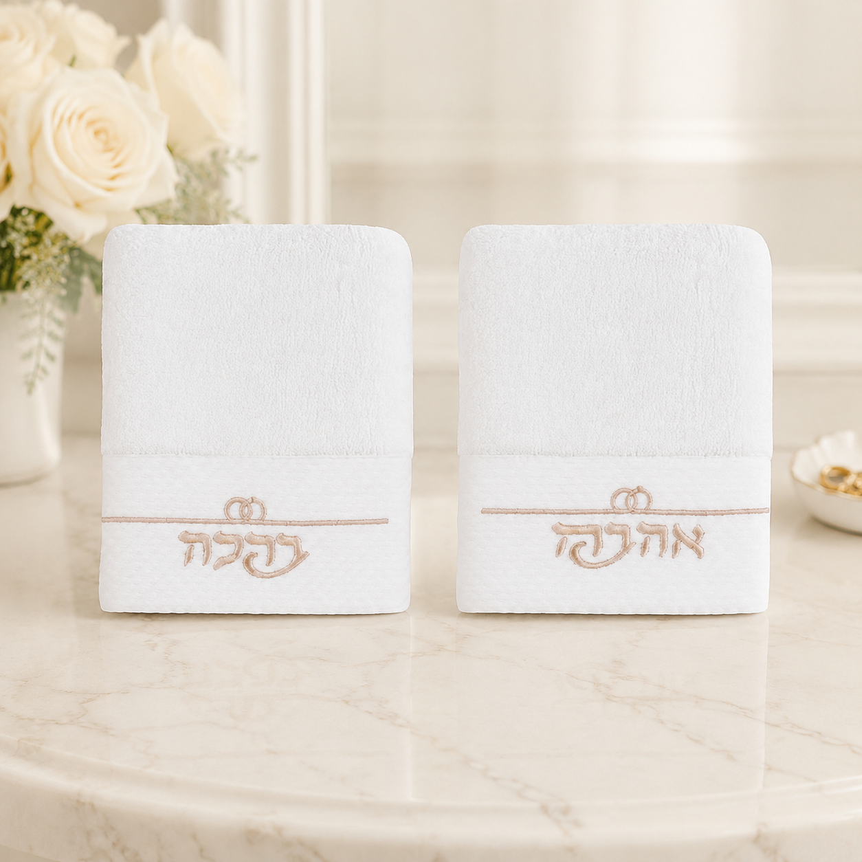 Pair of white bride and beloved embroidered face towels with wedding ring motif