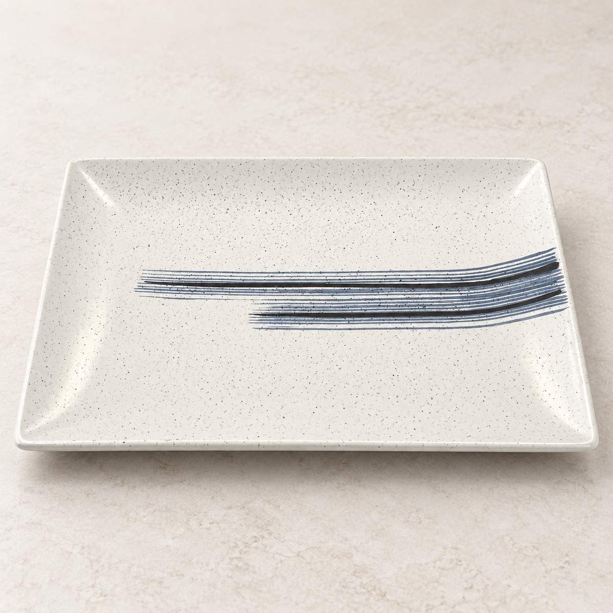 Ivory speckled ceramic serving platter with blue and black brushstroke design