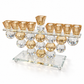 Crystal menorah with nine amber oil-cup holders, elevated angle