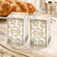Crystal Shabbat candlestick holders with gold plaques staged on a Shabbat table