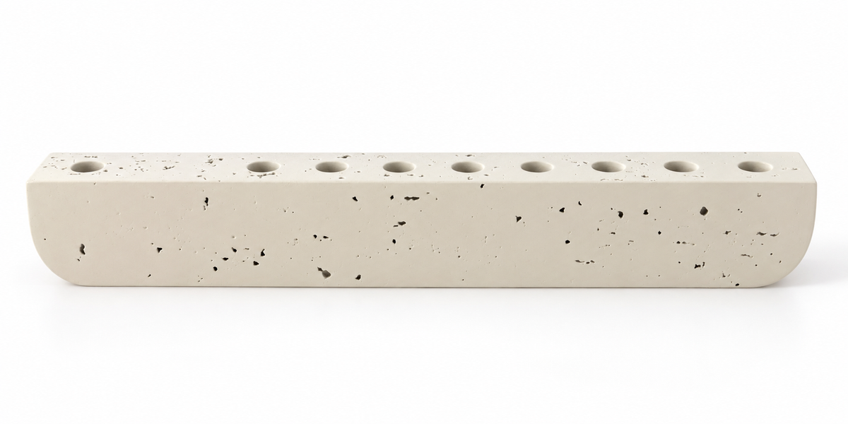 Ivory textured concrete hanukkiah with nine recessed holders, front view
