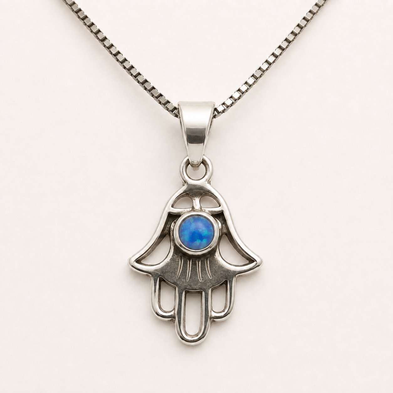 Women's sterling silver openwork Hamsa necklace with blue opal made in Israel