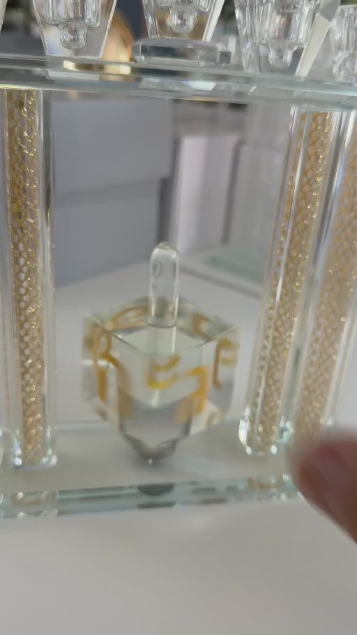 Crystal Tal Menorah with its central crystal dreidel spinning