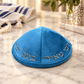 Turquoise blue velvet kippah with silver Hebrew embroidery, 19 cm