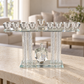 Silver Crystal Tal Menorah with spinning dreidel on a stone console in a bright modern home