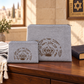 Silver gray laser engraved crown tallit and tefillin bag set with smaller pouch resting in front