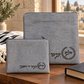 Silver gray laser engraved laurel tallit and tefillin bag set in a Jewish home setting