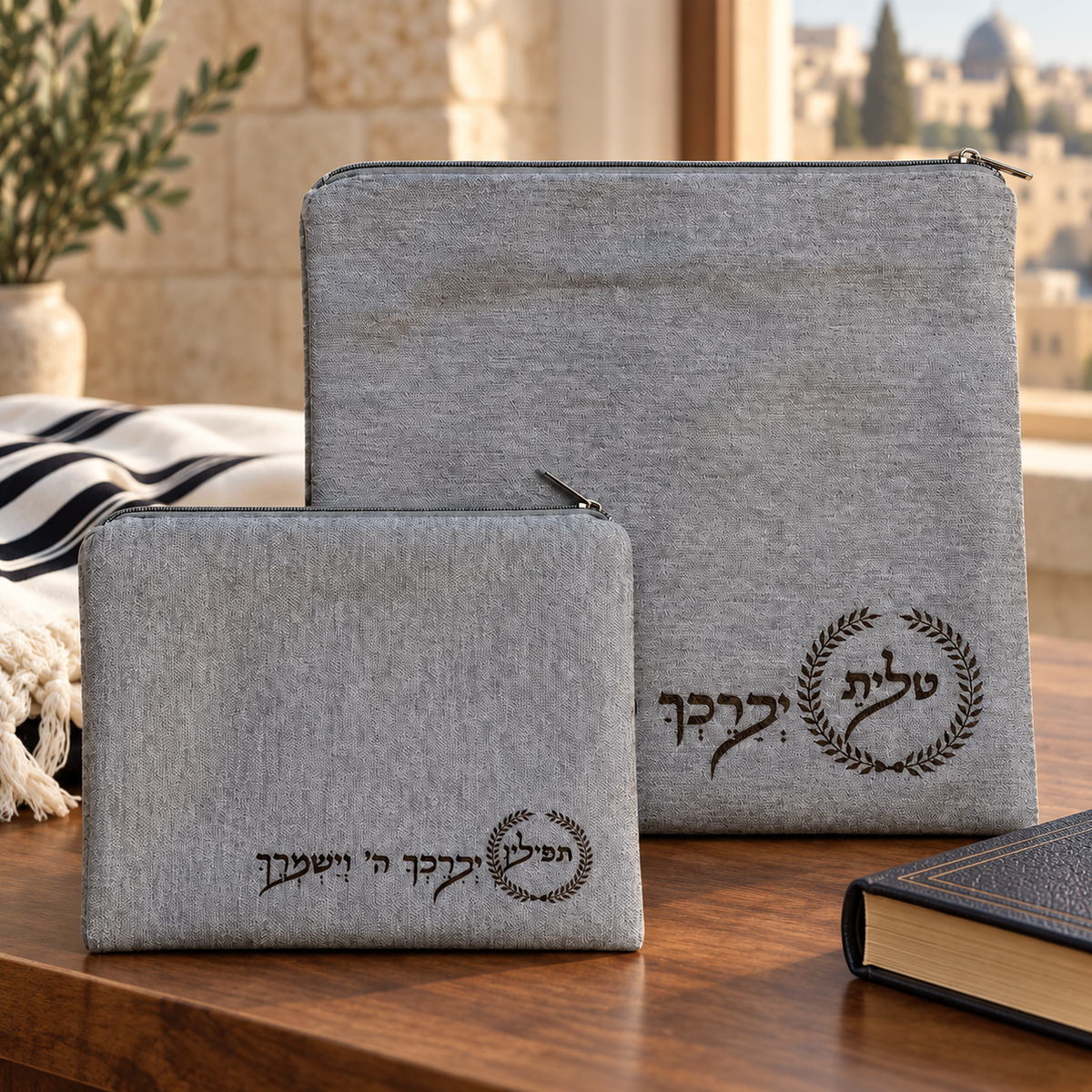 Silver gray laser engraved laurel tallit and tefillin bag set in a Jewish home setting