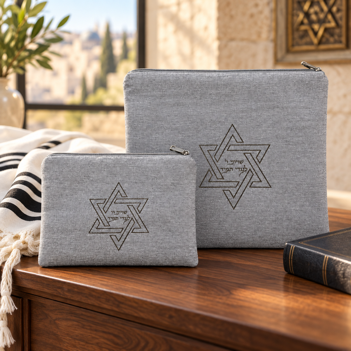 Silver gray laser engraved Star of David tallit and tefillin bag set in a Jewish home setting