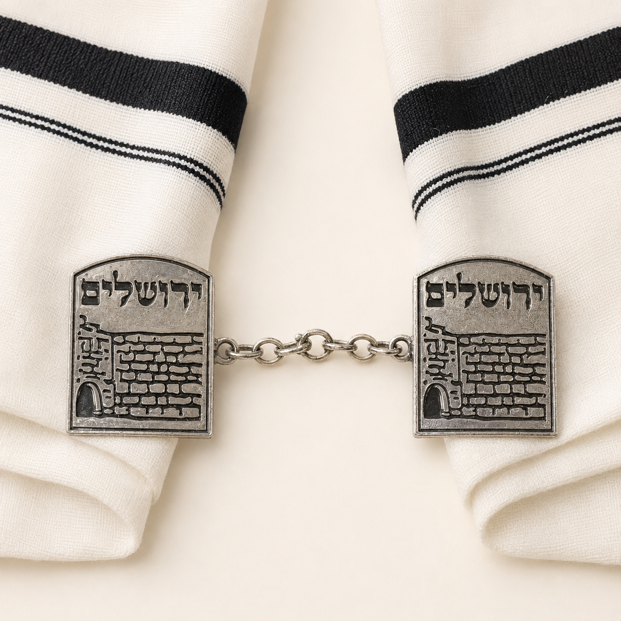 Silver-tone Jerusalem tallit clips connected by a chain