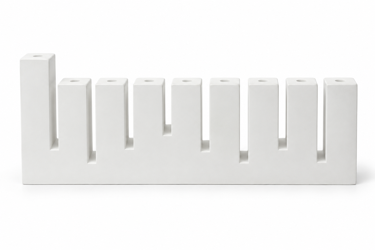 White concrete Hanukkah menorah with nine rectangular holders and raised left shamash, front view