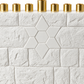 Close-up of the white Star of David motif, concrete brick texture, and taller center gold-tone shamash holder.
