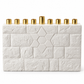 White concrete Star of David Hanukkah menorah with a textured brick-pattern front and nine gold-tone candle holders on a white background.