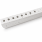 Close-up of white concrete hanukkiah showing subtle textured pores and recessed holders