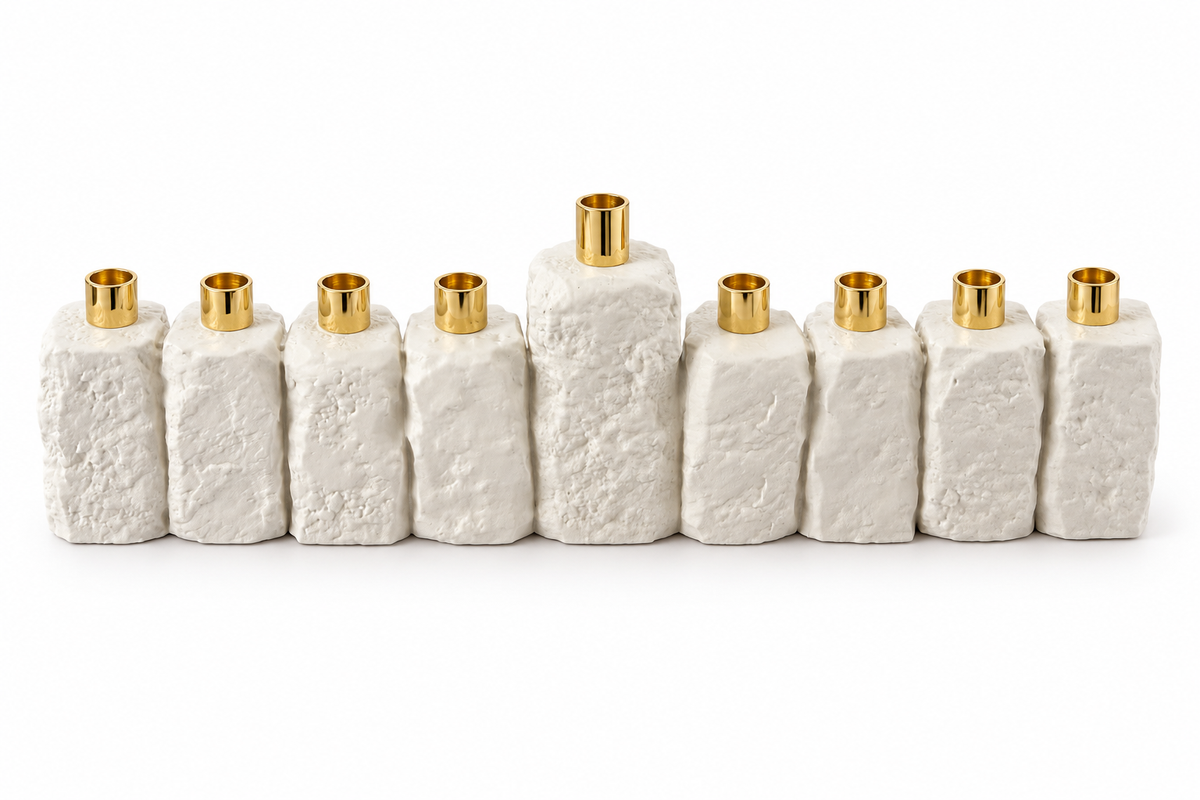 White textured concrete Hanukkah menorah with nine gold-tone holders and a raised center shamash on a white background.
