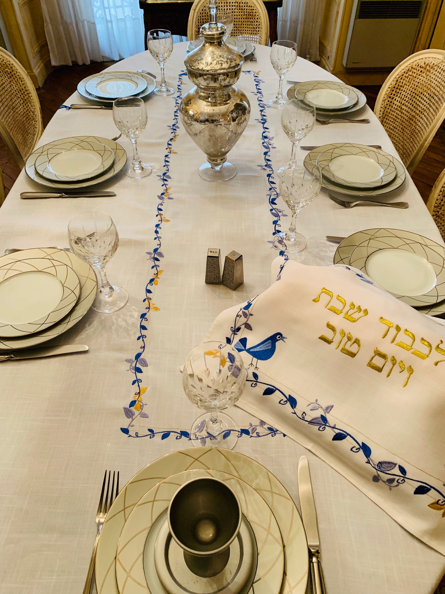 The Blue Bird Tablecloth Embroidered on Pure White Linen. Matching Challah Cover is available