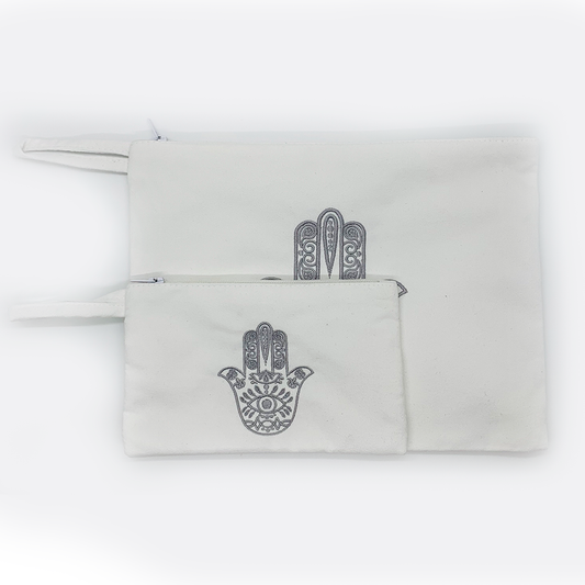 Embroidered hamsa Suede black or white bag zipper closure. Satin lining.